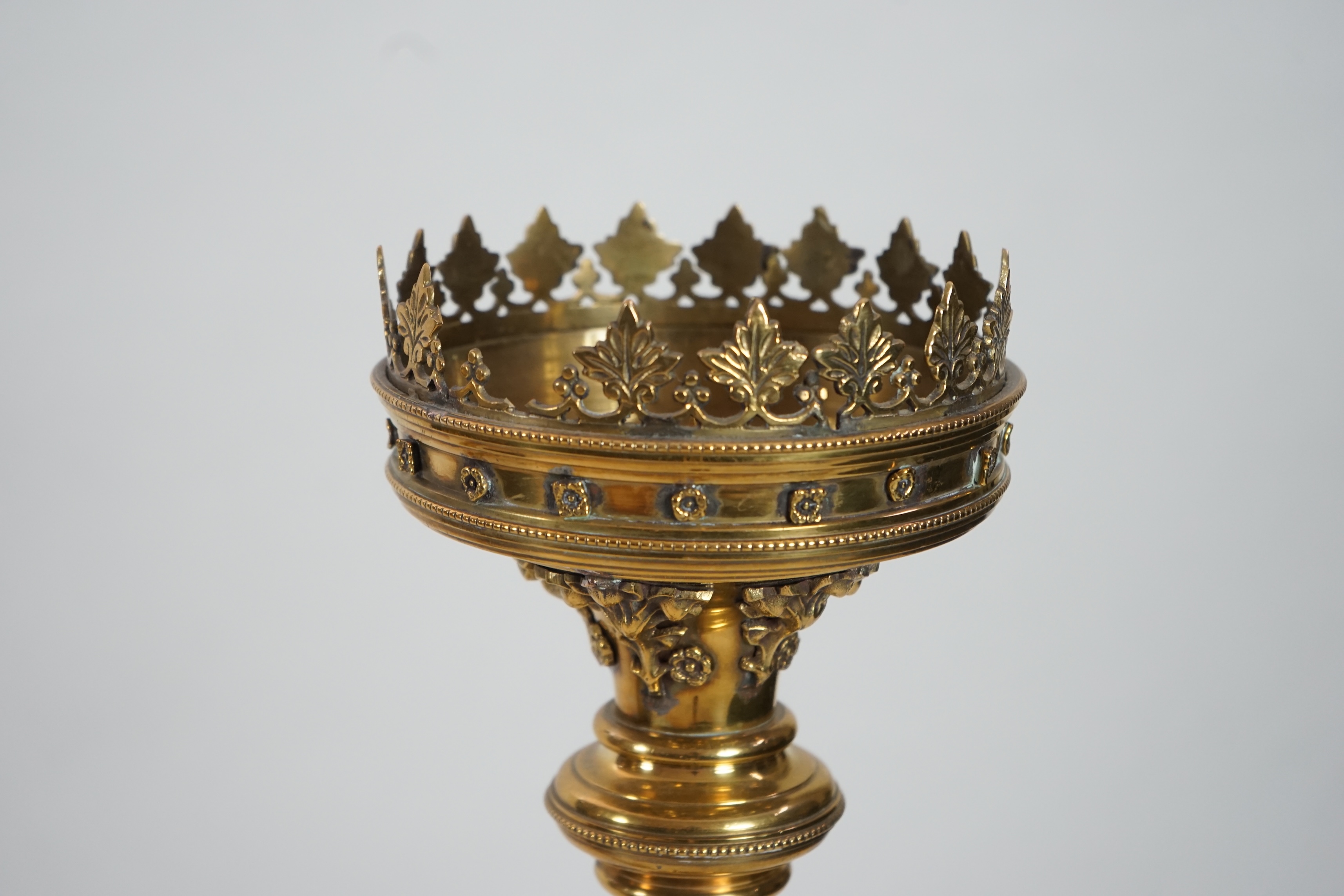 A pair of Victorian Gothic brass altar sticks